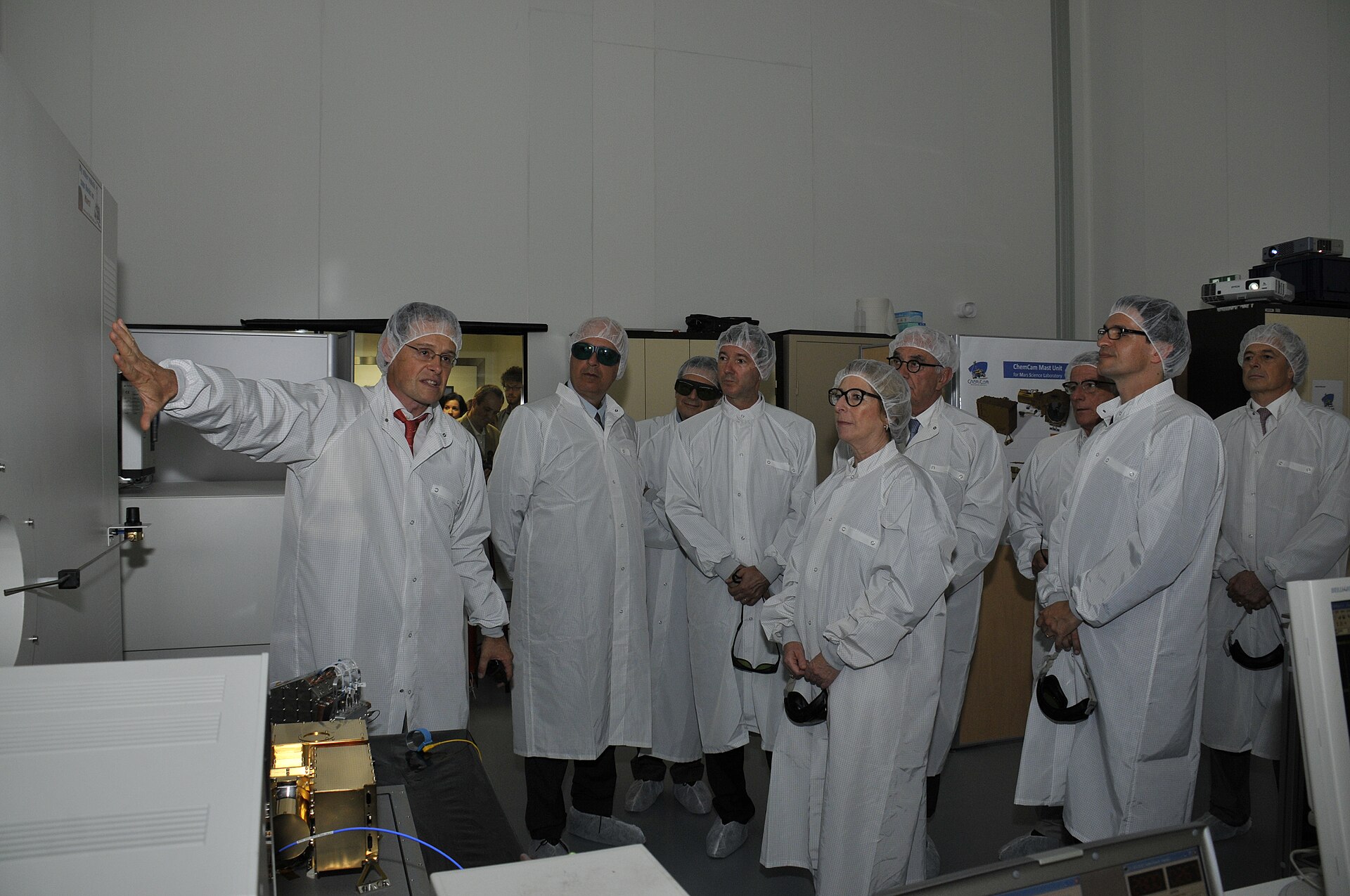 Semiconductor cleanroom engineers working on silicon wafer production lines