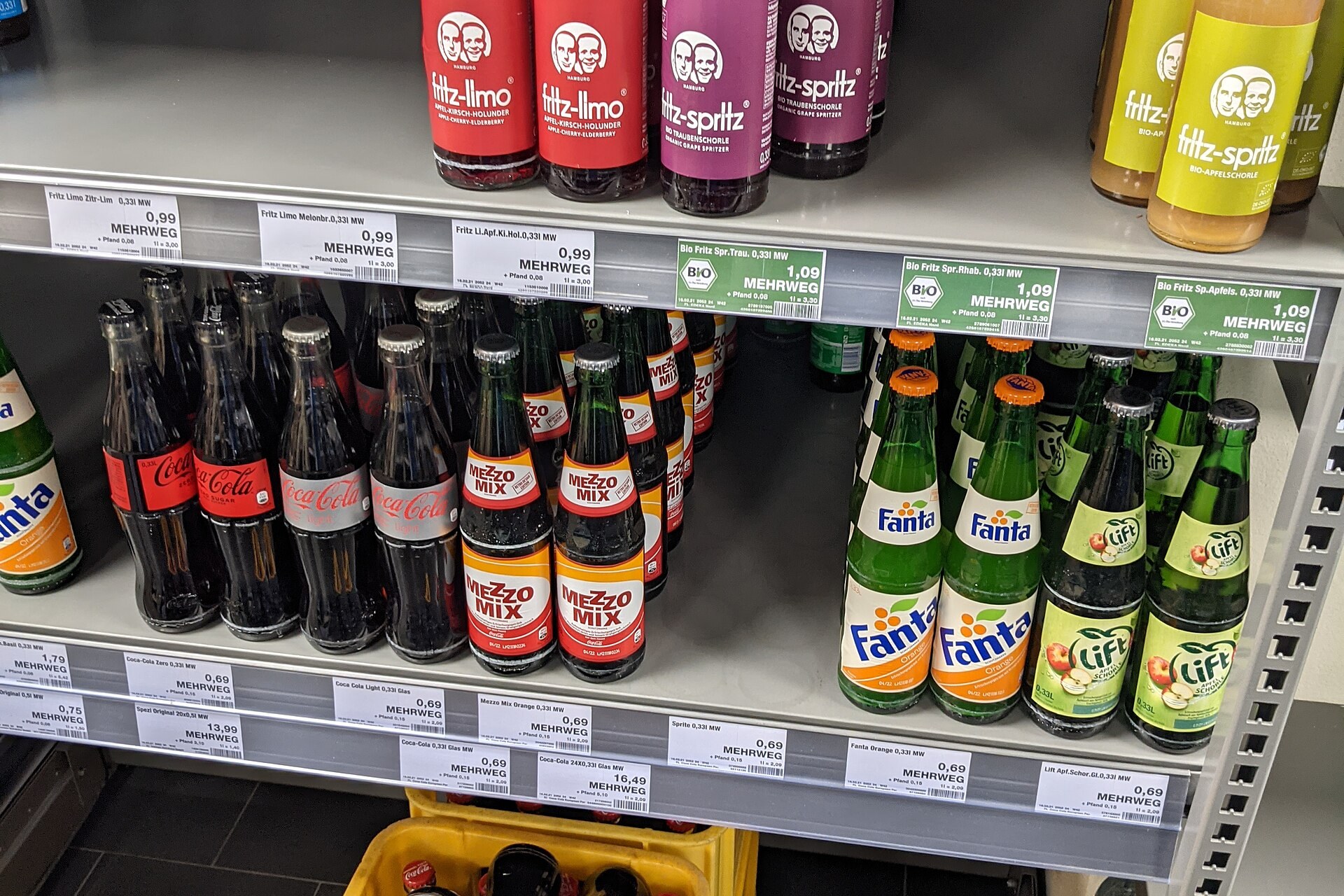 Supermarket aisle with packaged foods and nutrition labels on shelves